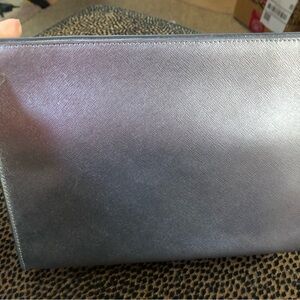 NWT!
Gorgeous silver leather clutch, Neiman Marcus!